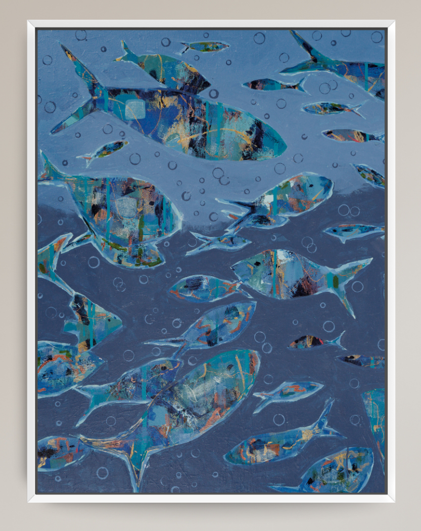 Framed abstract art print depicting a school of fish swimming underwater, rendered in shades of blue, teal, and gold with white bubbles, set in a white frame.