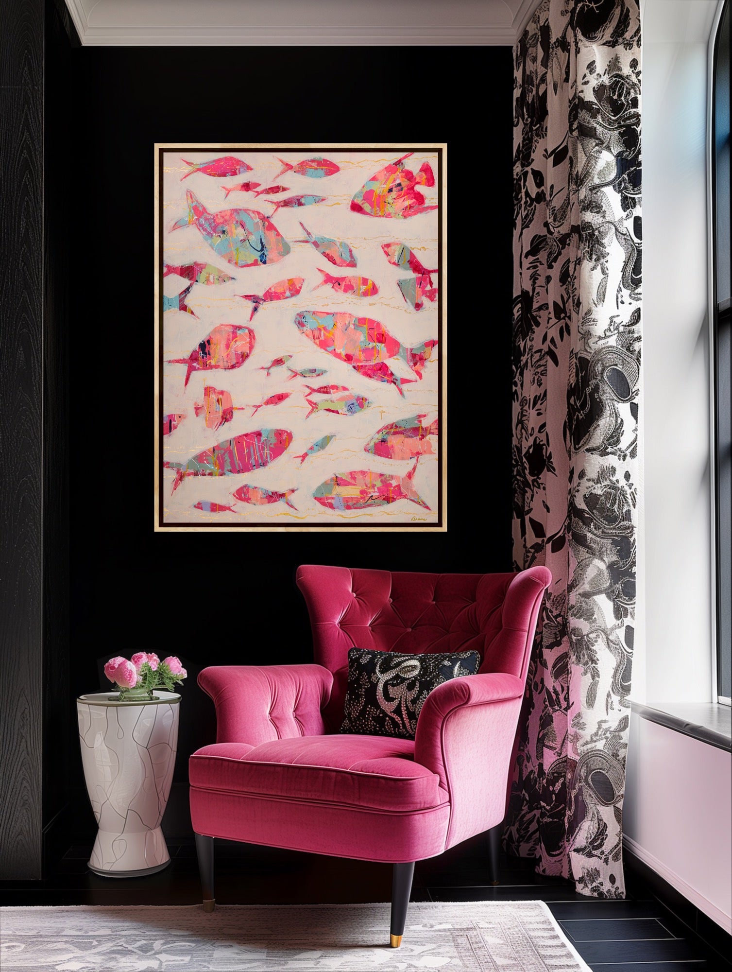 Pink armchair in a room with a colorful fish artwork on the wall.