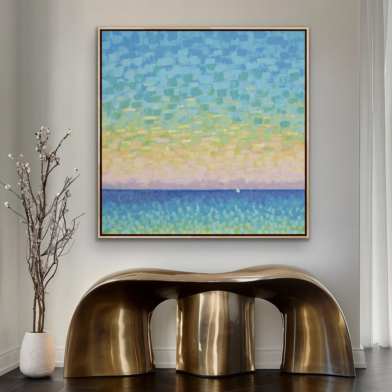 Modern interior with a gold console table, abstract sunset seascape painting, and large window.