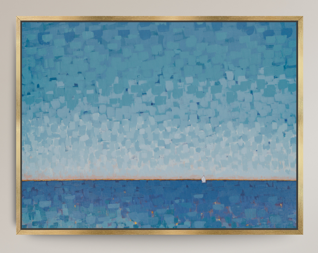 A framed square painting featuring a textured blue and light blue landscape with a small white sailboat on the horizon, enclosed in a thin gold frame against a light beige wall.