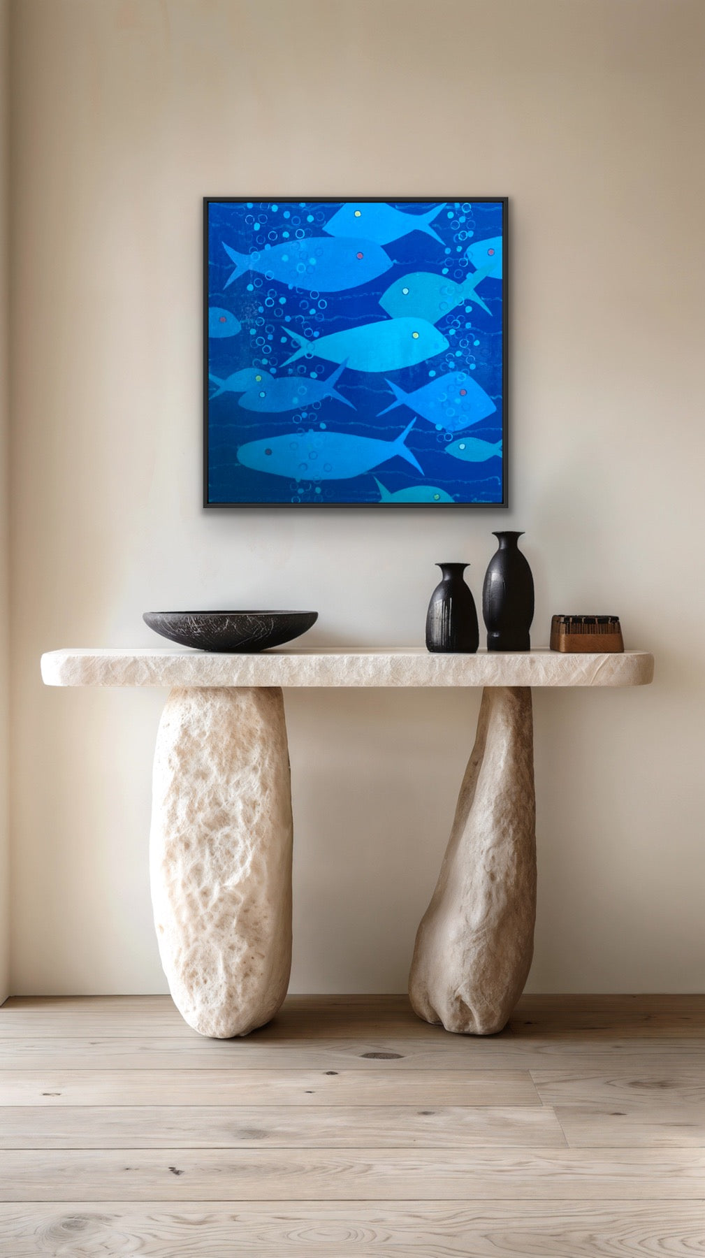 abstract blue themed fish painting above a entry way table