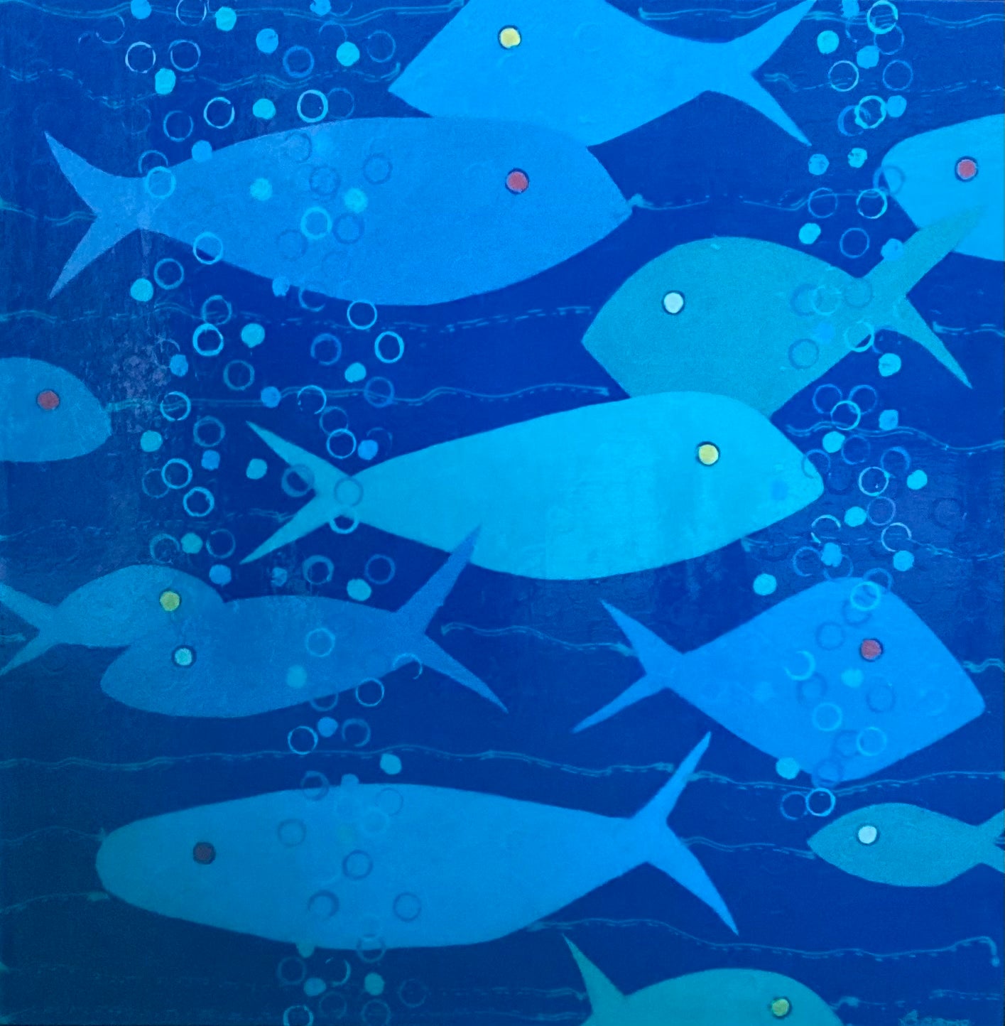Artistic depiction of blue fish swimming underwater with bubbles on a blue background