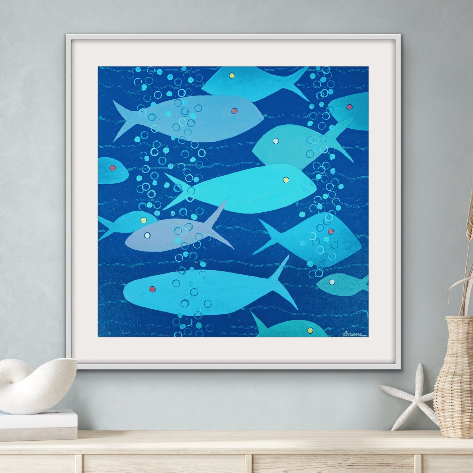 comical modern fish artwork above console