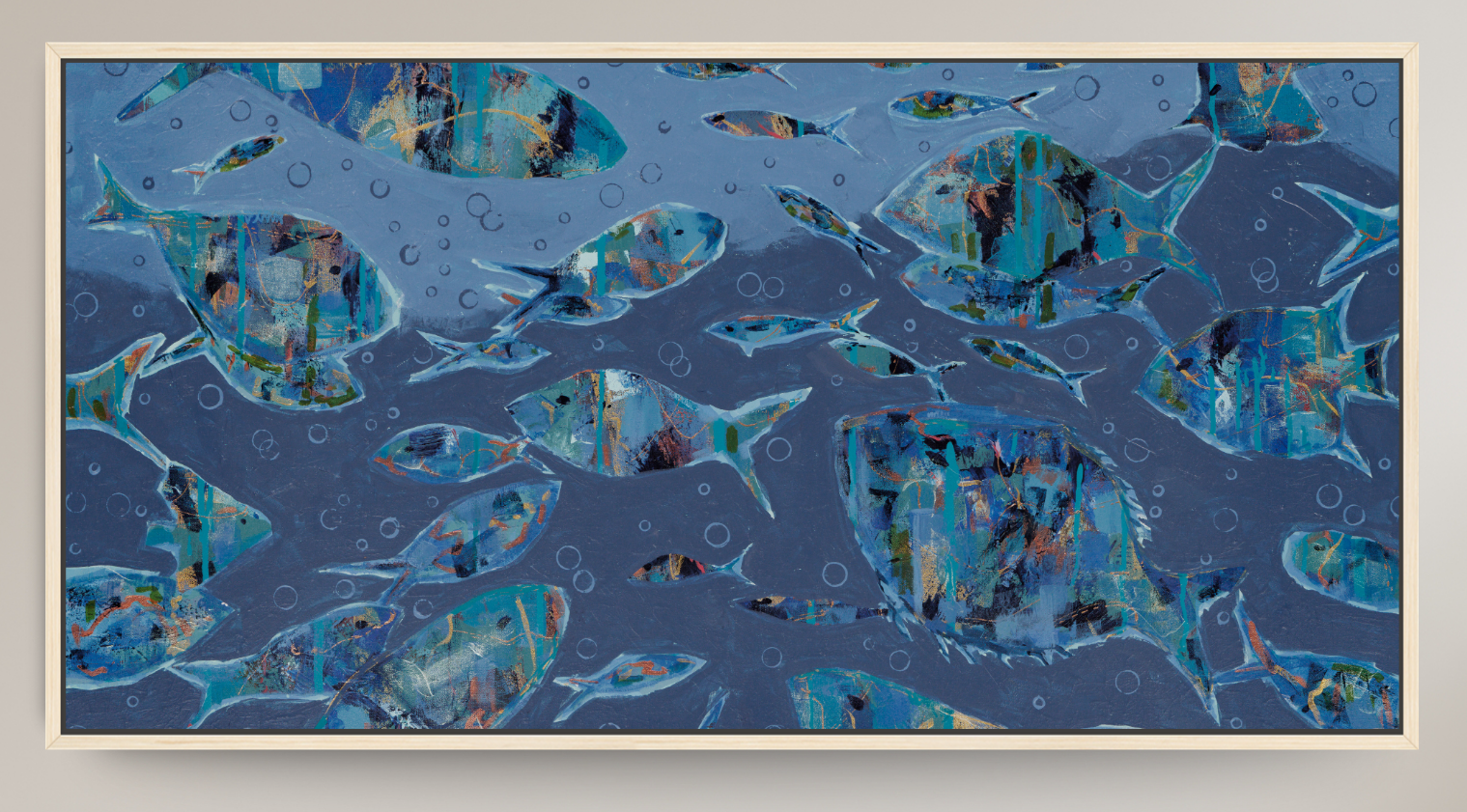 A framed abstract art print depicting a school of fish swimming underwater in shades of blue, teal, and gray, with a light beige frame.