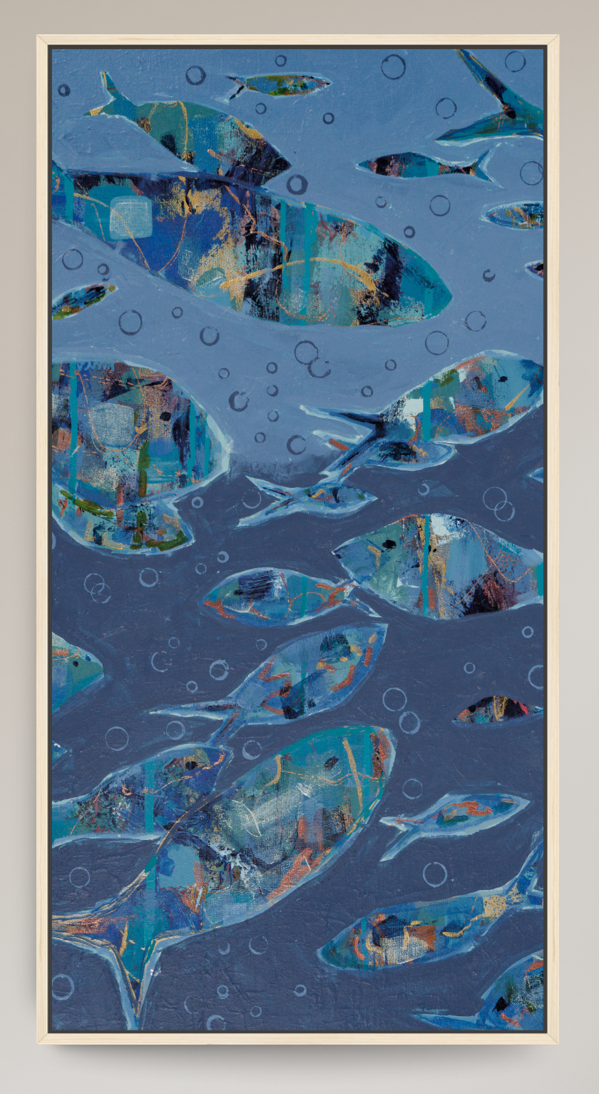 An abstract art print depicting a school of fish swimming underwater, rendered in shades of blue, teal, and gold with bubble details, presented in a light wood frame.
