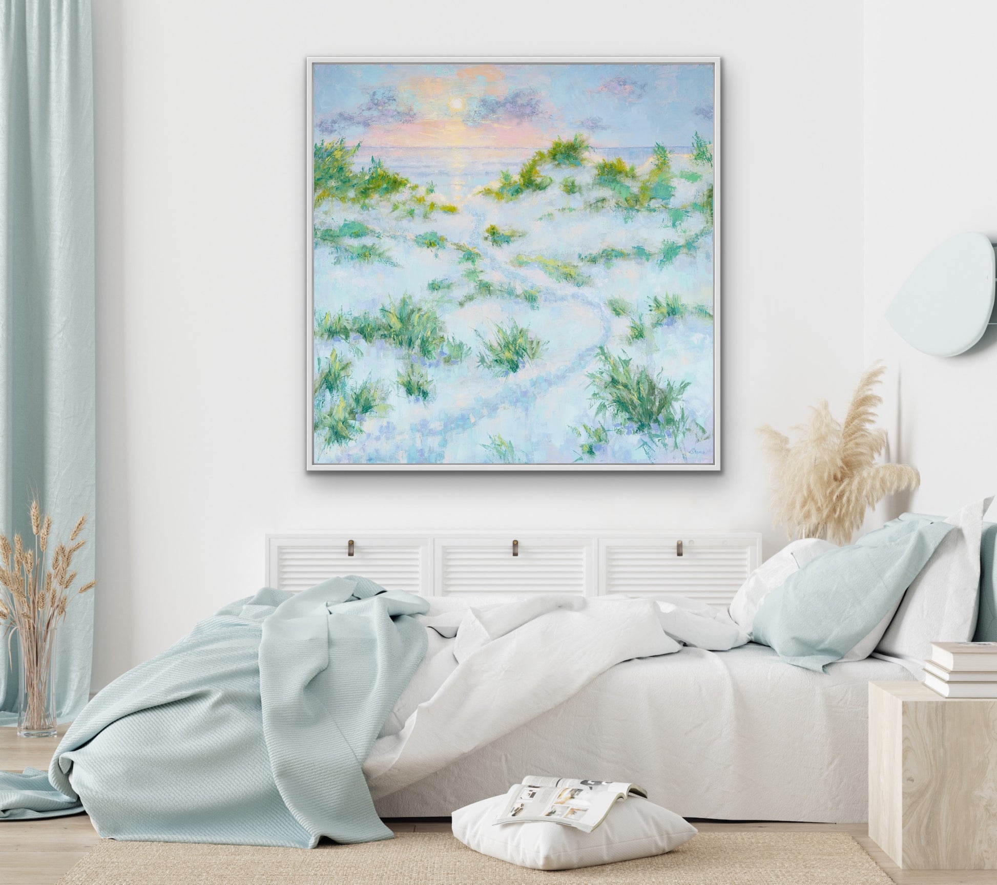 Bedroom with a large coastal sunrise landscape abstract painting on the wall