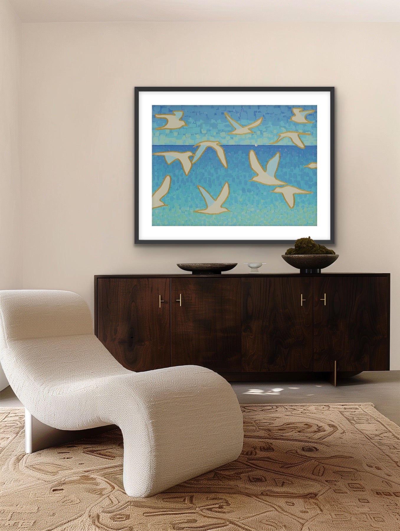 Coastal fine art canvas featuring gold-outlined seagulls soaring above tranquil turquoise and blue hues above a wooden cabinet with a white chair in a room.