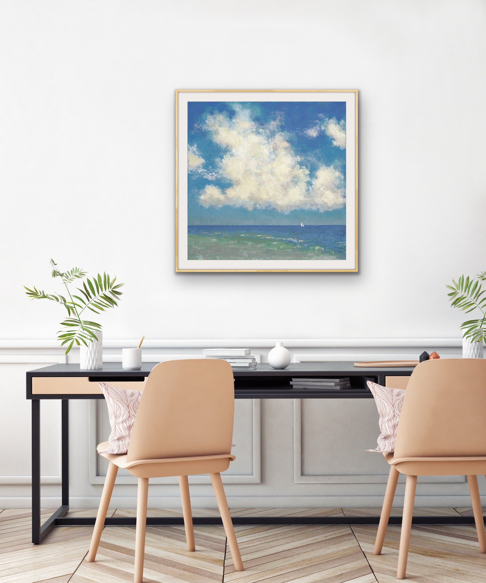 Elegant Sun filled seascape with sailboat with a desk and chairs