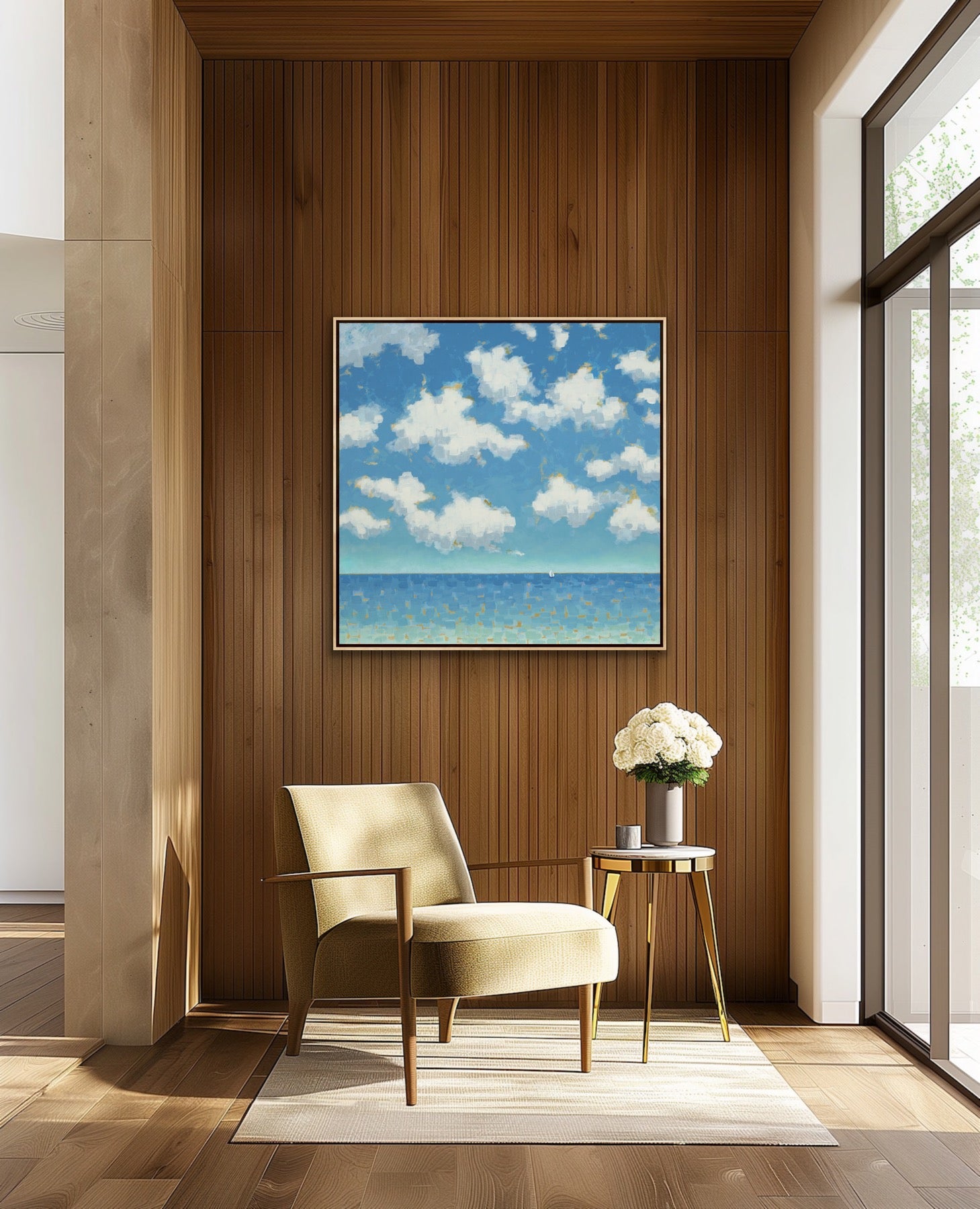 Modern interior with a beige armchair, side table, and a 48” x 48” original ocean horizon painting with serene blue tones and balanced composition of a blue sky with clouds.