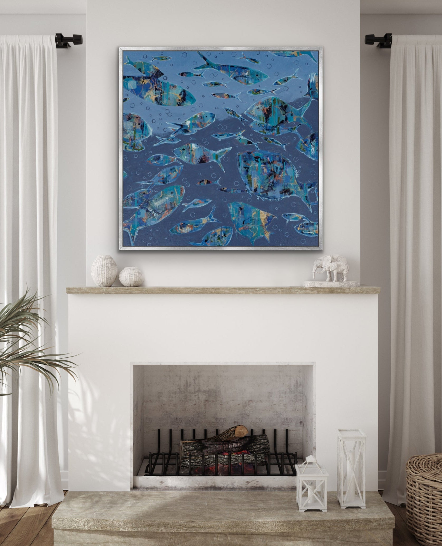 abstract fish artwork above a white fireplace with white walls and white curtains.