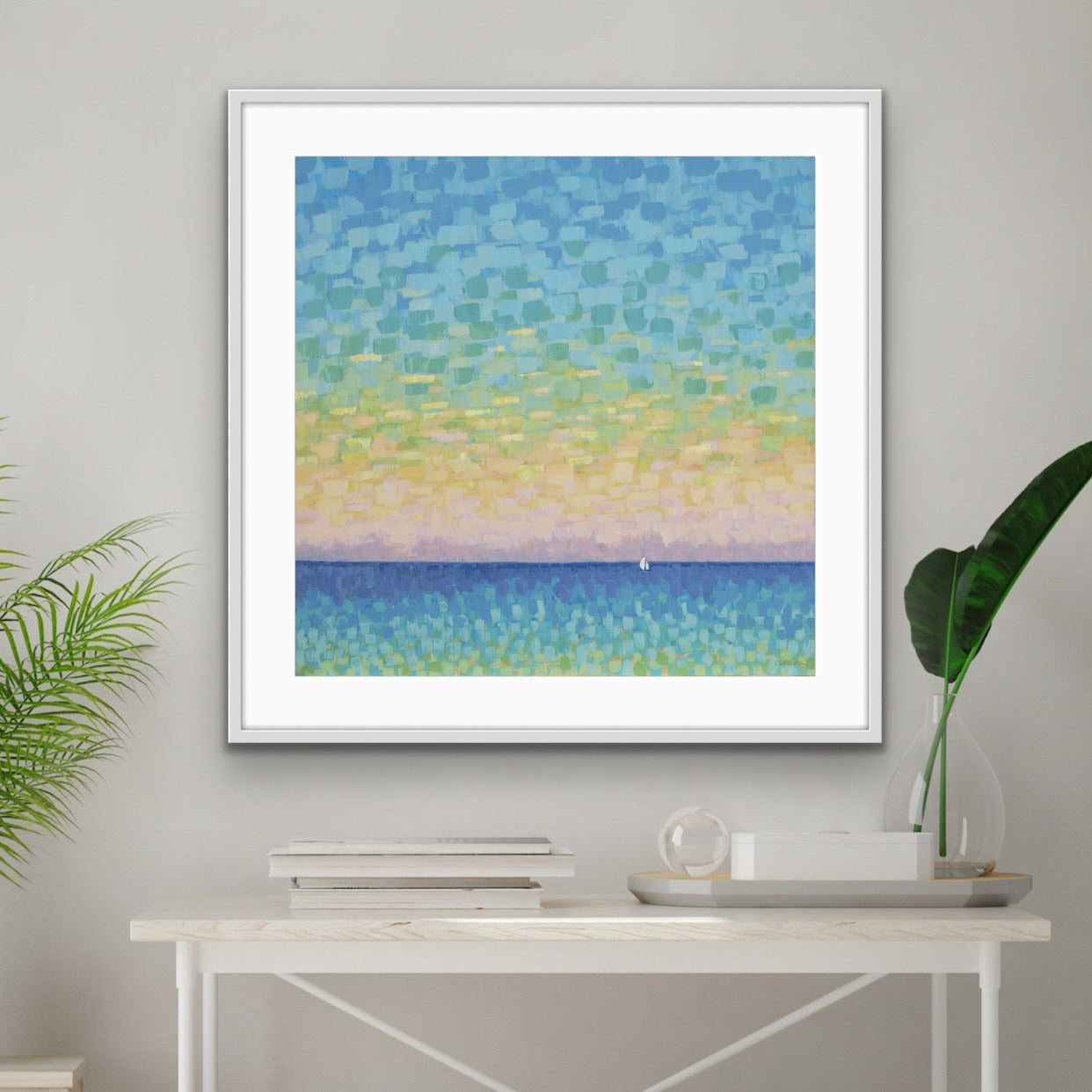 Sunset Ocean landscape framed above entry table