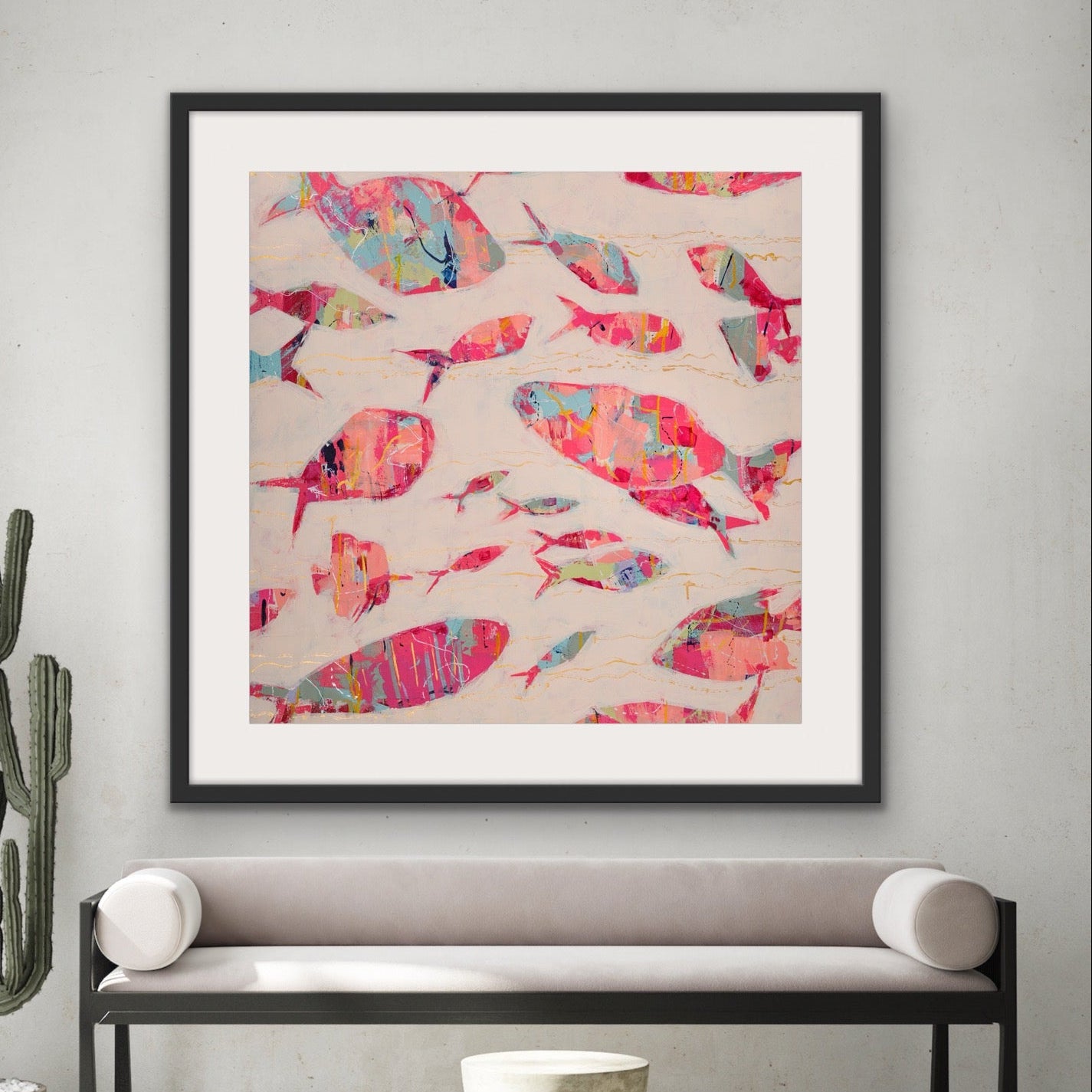 Contemporary ocean-inspired abstract fish square artwork on a wall above a bench in a modern interior setting.