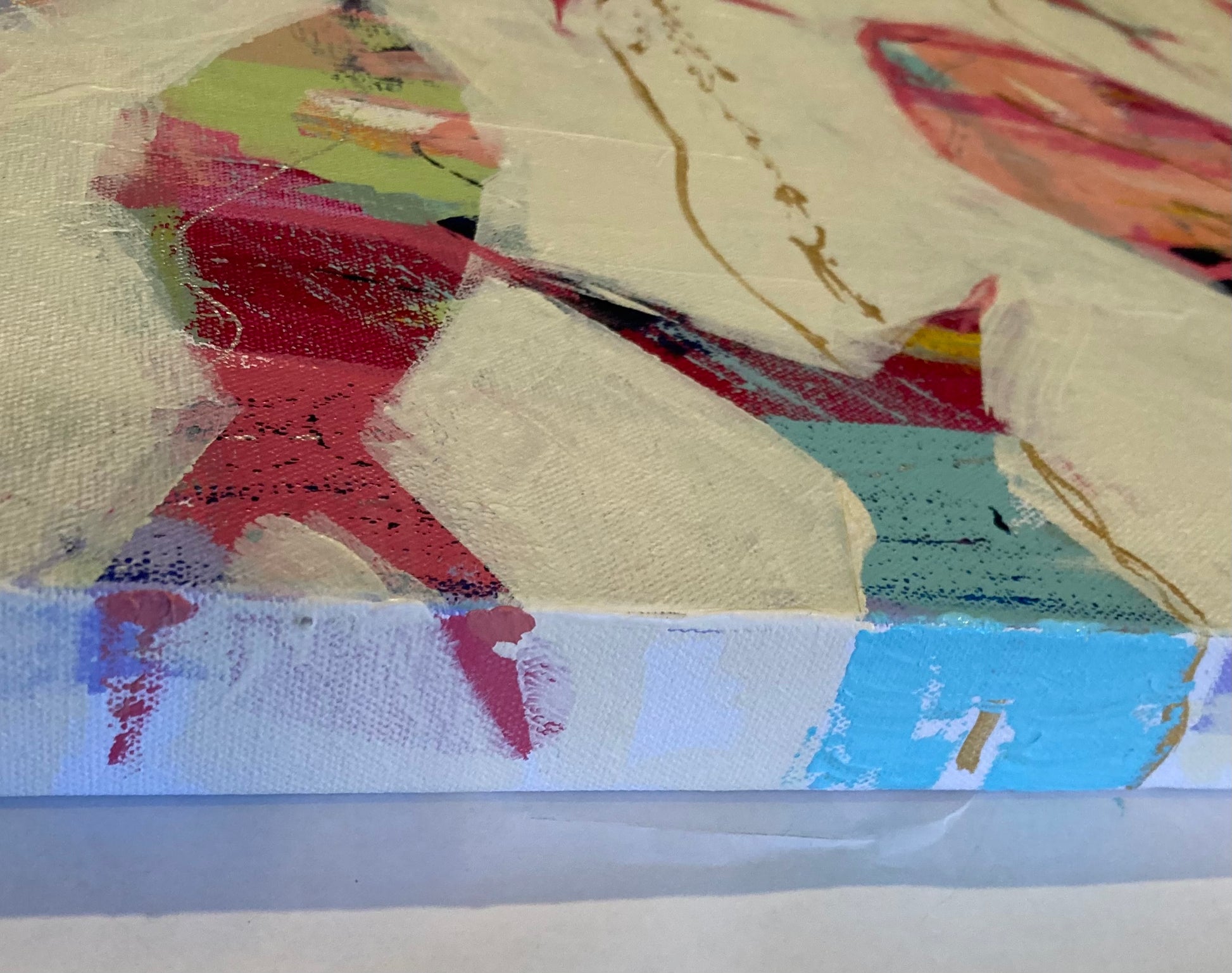 Close-up detail of iridescent gold wave lines and layered texture in a contemporary coastal abstract fish painting