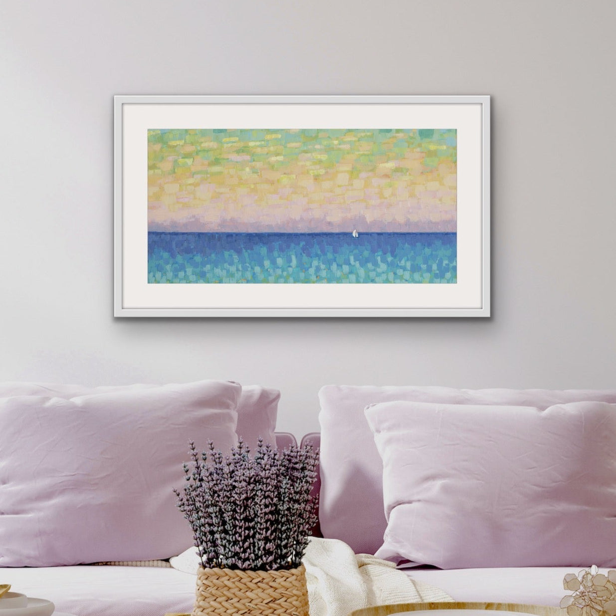 Sunset Sail panoramic pastel seascape cotton rag abstract painting on a wall above a sofa with decorative items.