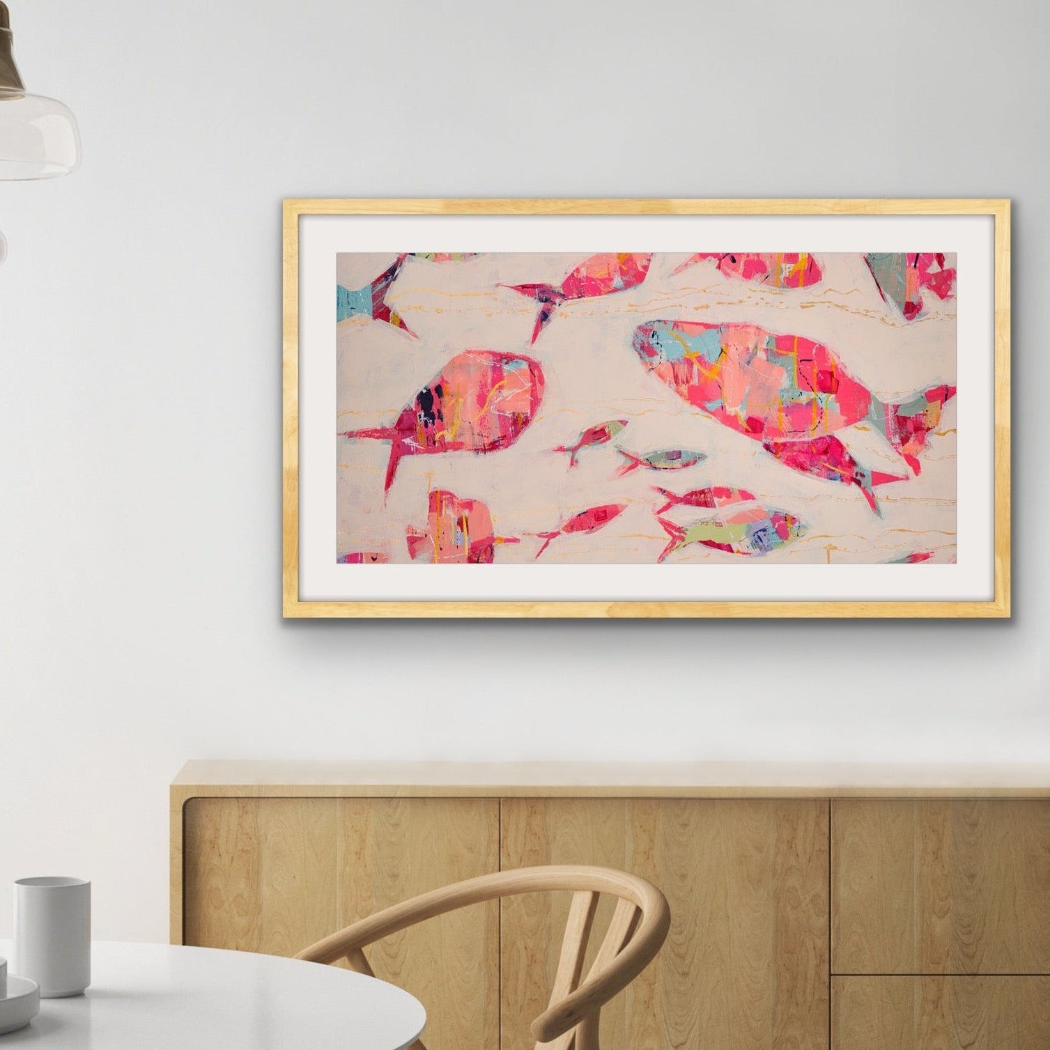 The Current Collective cotton rag print with abstract coral fish by Martha Brane in a modern dining room setting