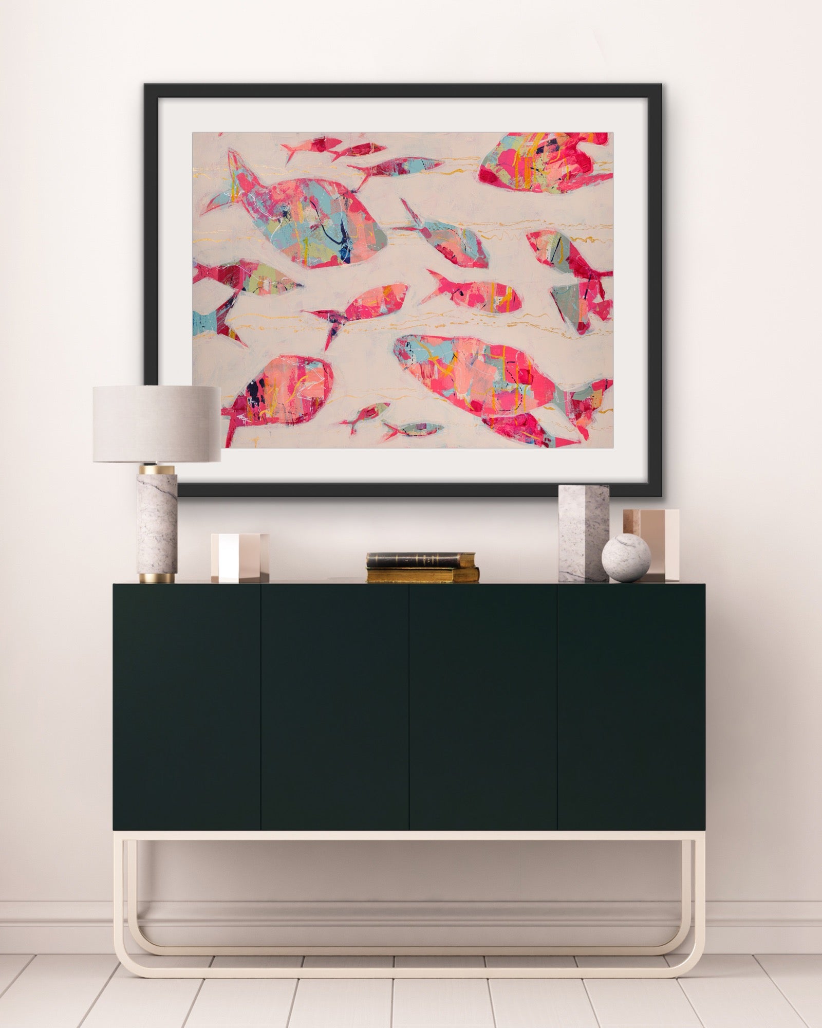 Colorful underwater fish scene in horizontal cotton rag edition on a wall above a black cabinet.
