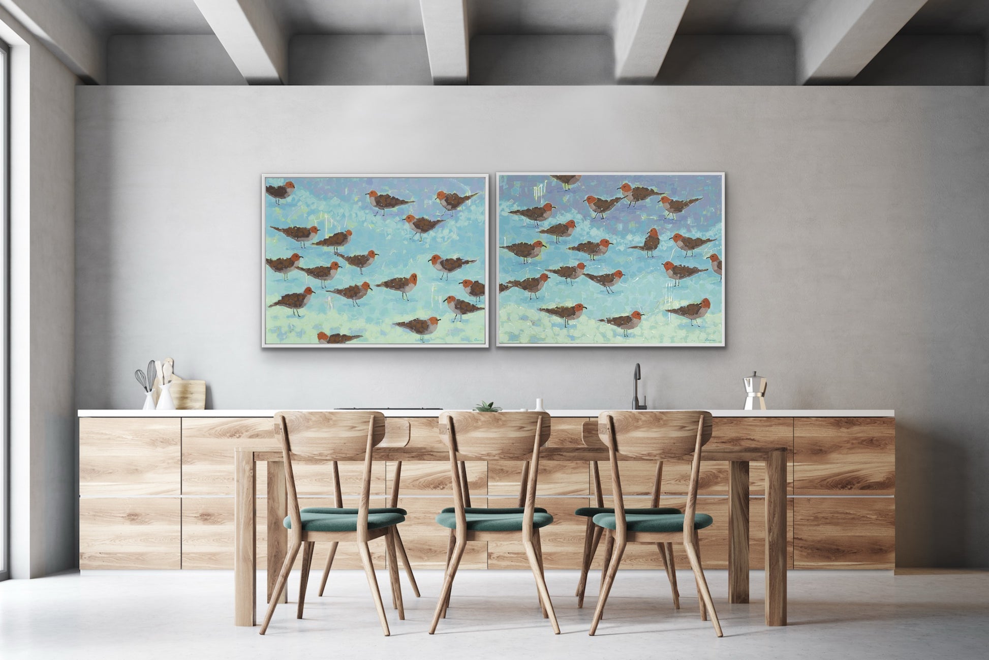 Luxury ocean-inspired giclée canvas pair featuring shorebirds in aqua and seafoam hues in a dining room with wooden table and chairs. 