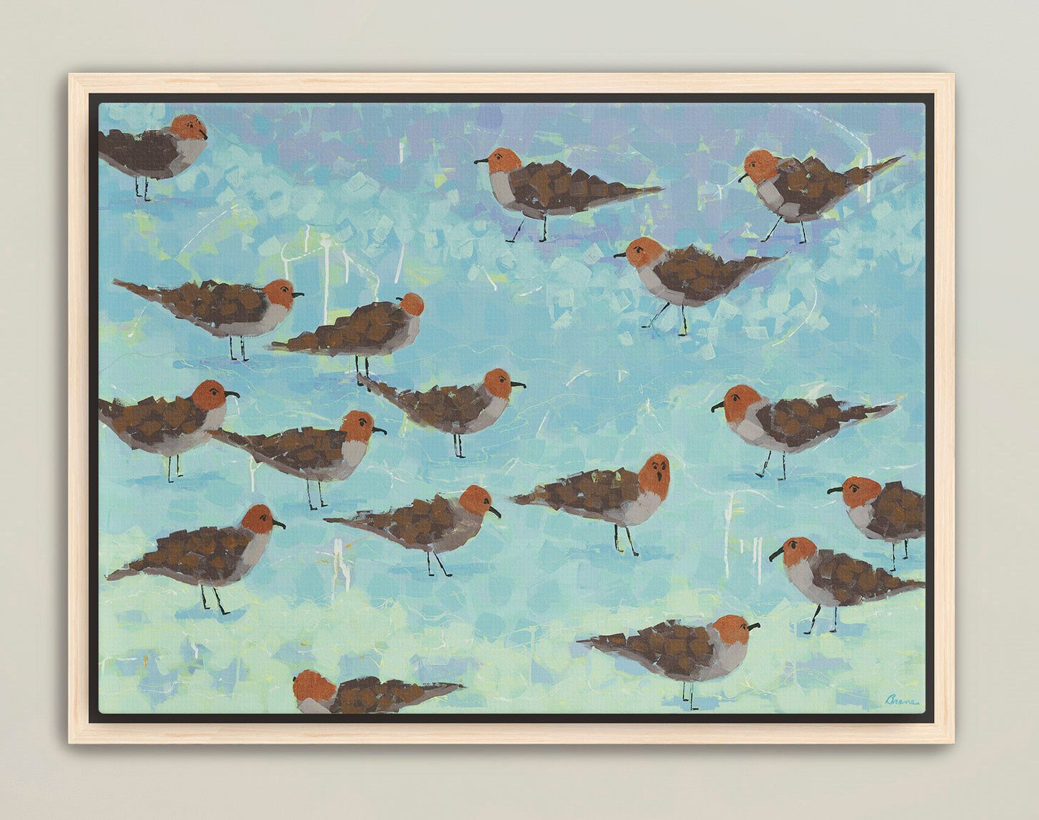 Modern coastal wall art with playful sandpipers in soft blue tones