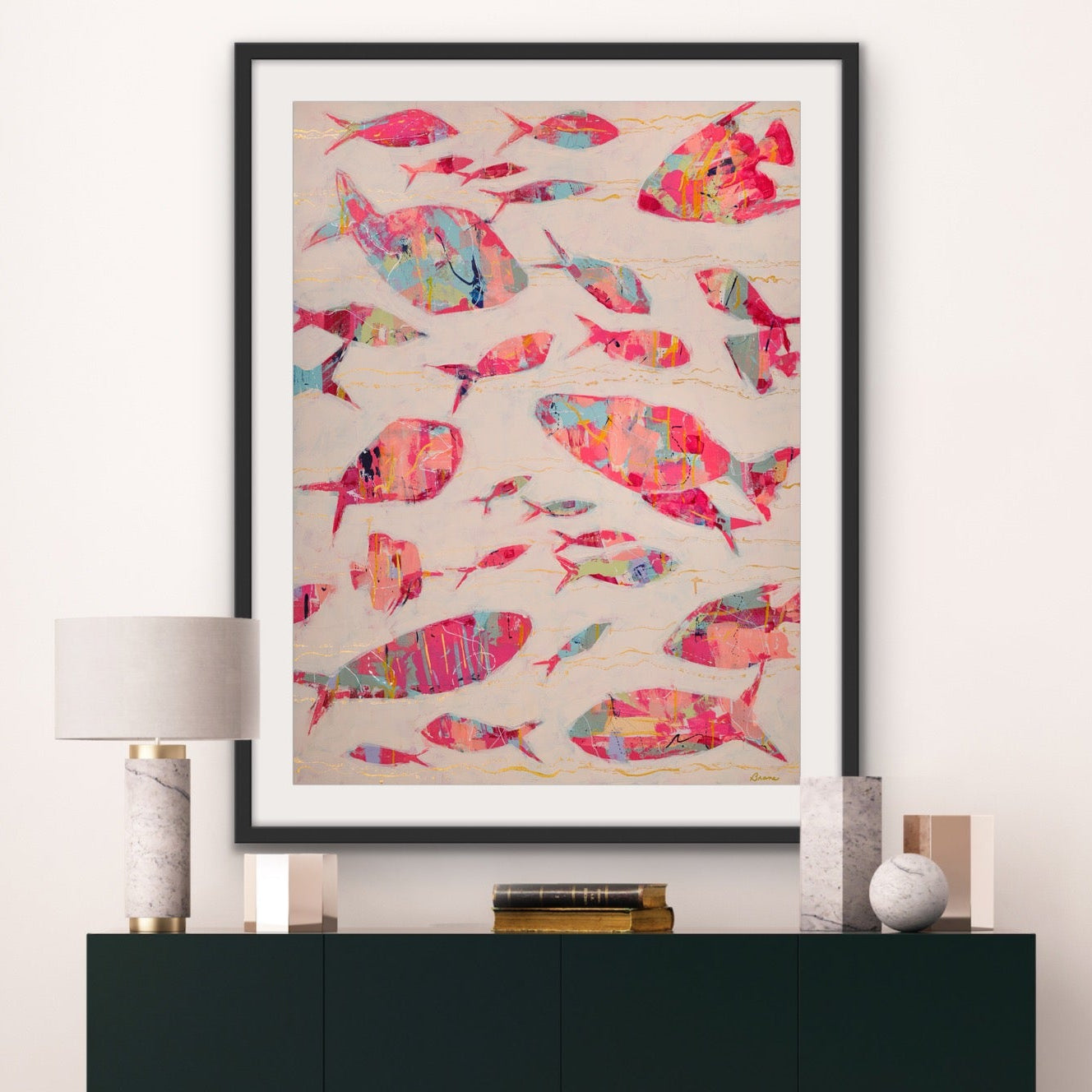 Modern interior with a black cabinet and colorful fish artwork on the wall.