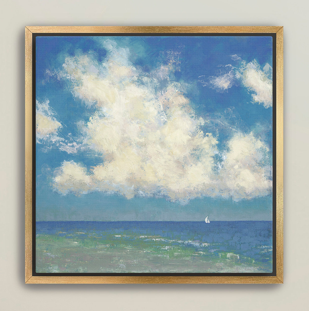 Gold framed ocean horizon artwork with sailboat and towering clouds