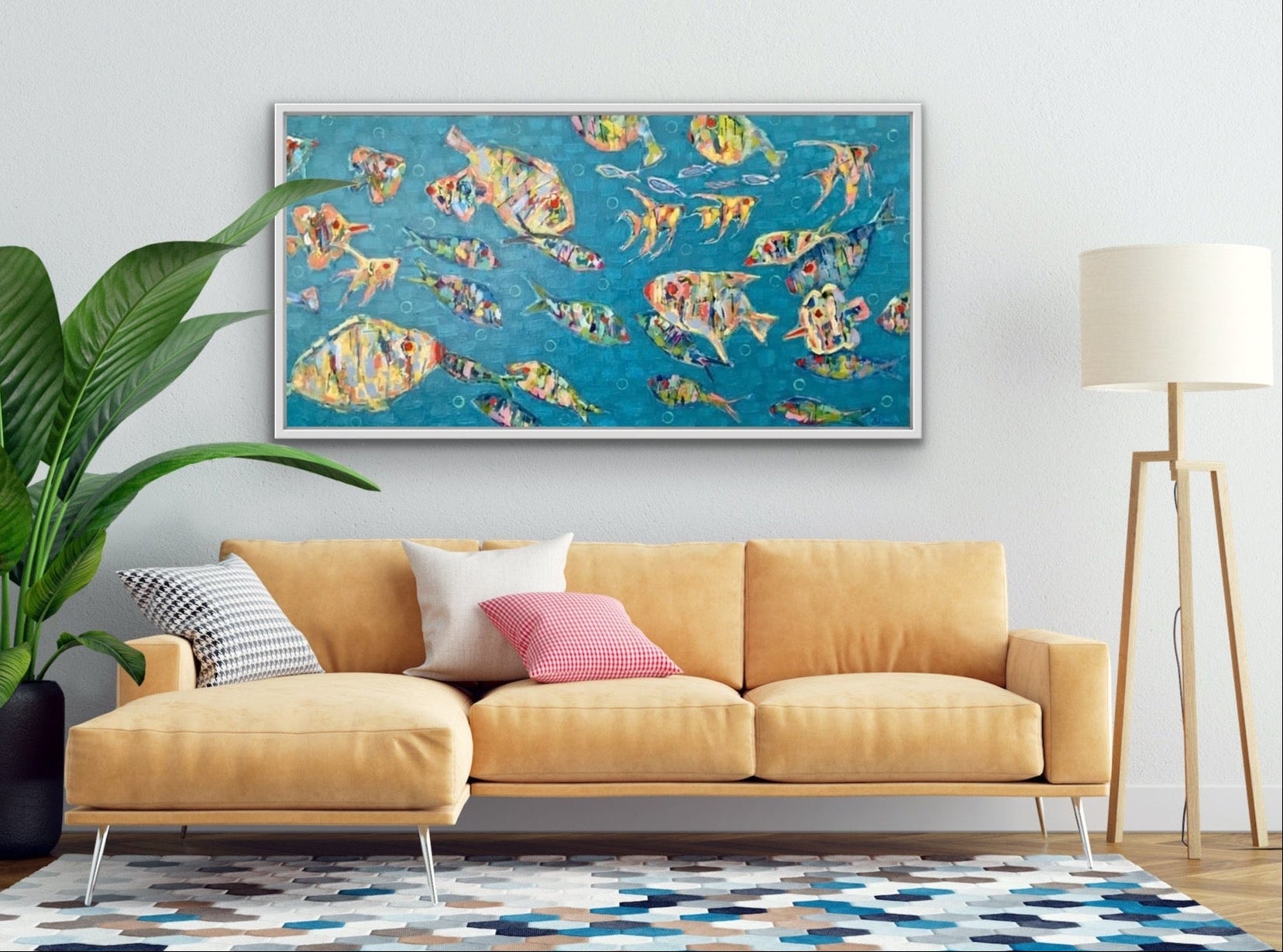 Living room with a yellow sofa, colorful abstract fish painting, and decorative rug.