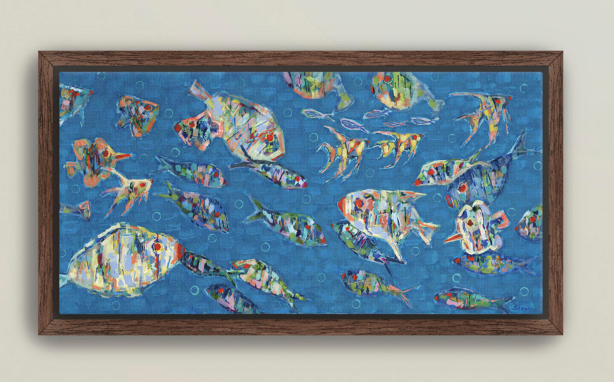 Framed giclée canvas featuring colorful school of fish on blue background
