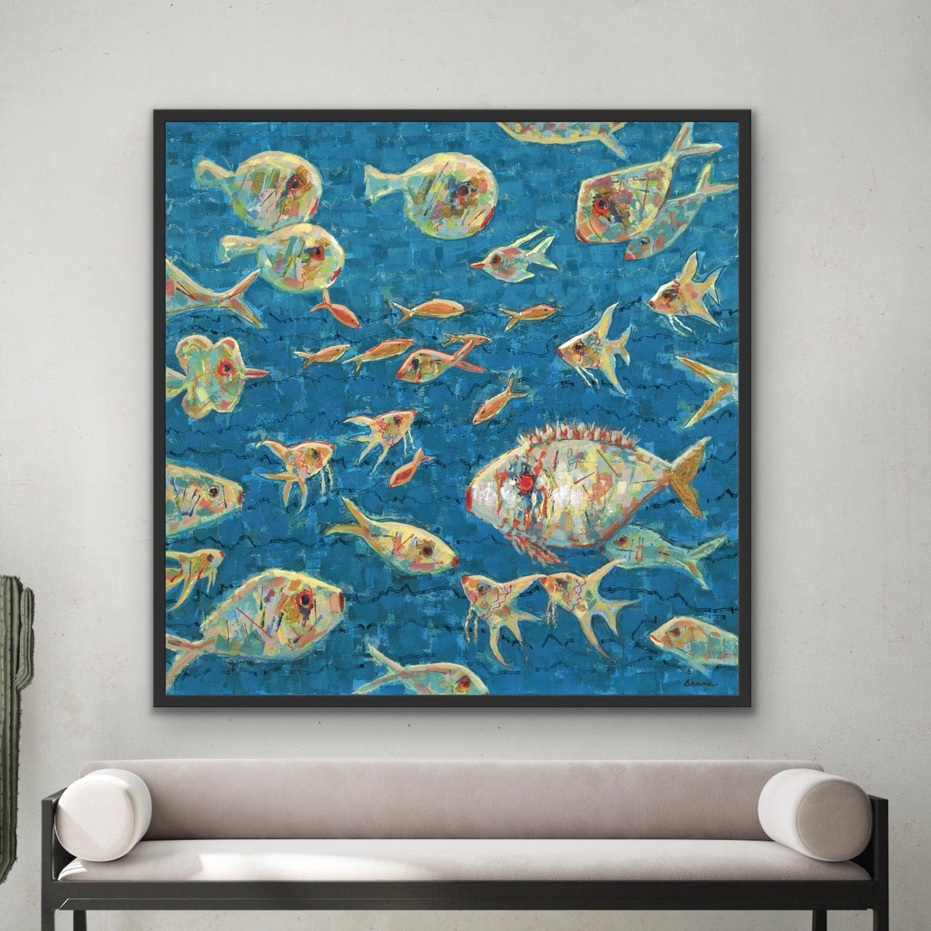 Framed artwork of coastal colorful sbstract fish in a modern interior setting.