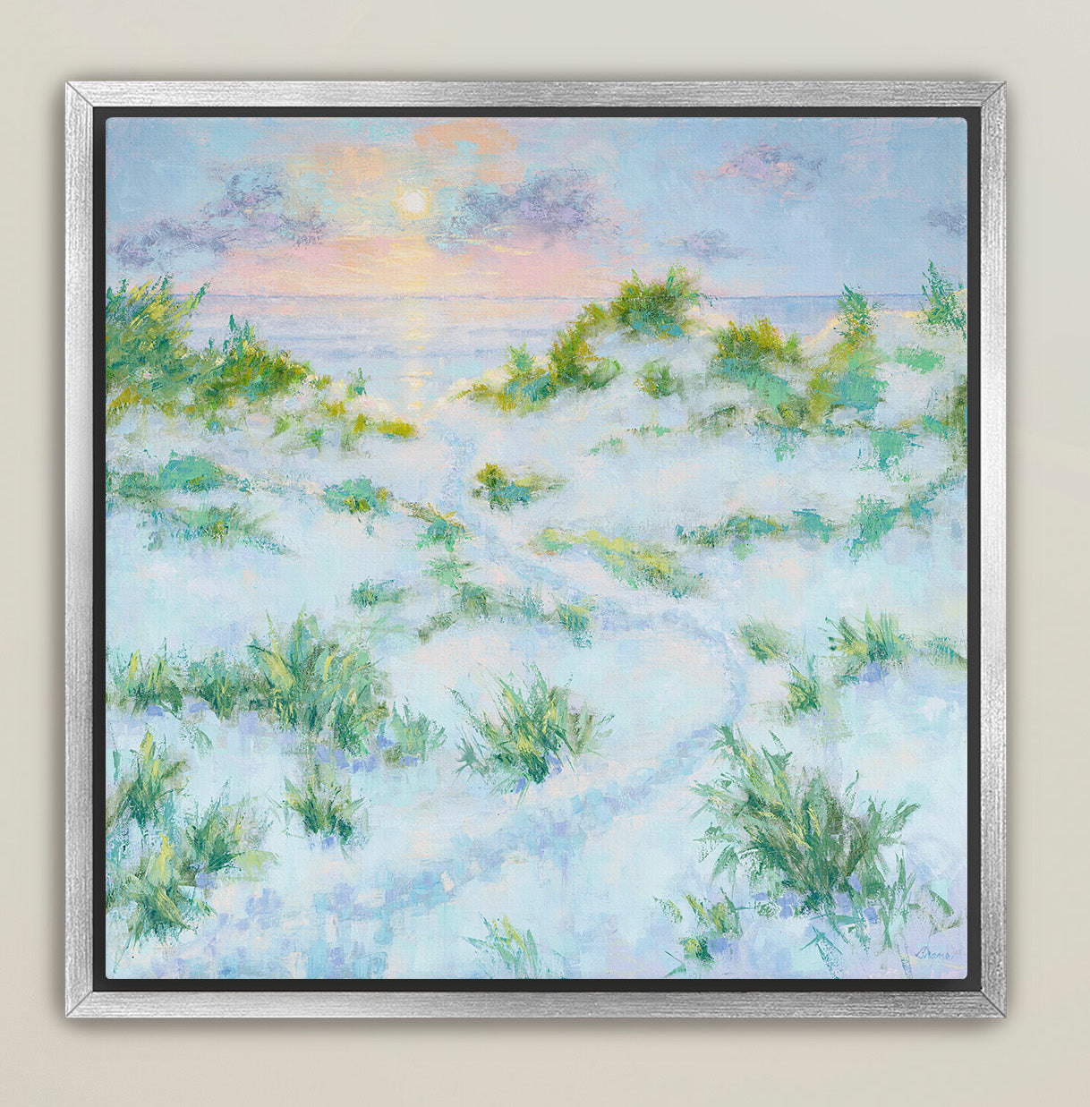 Soft coastal sunrise painting in a silver frame for modern beach home interiors