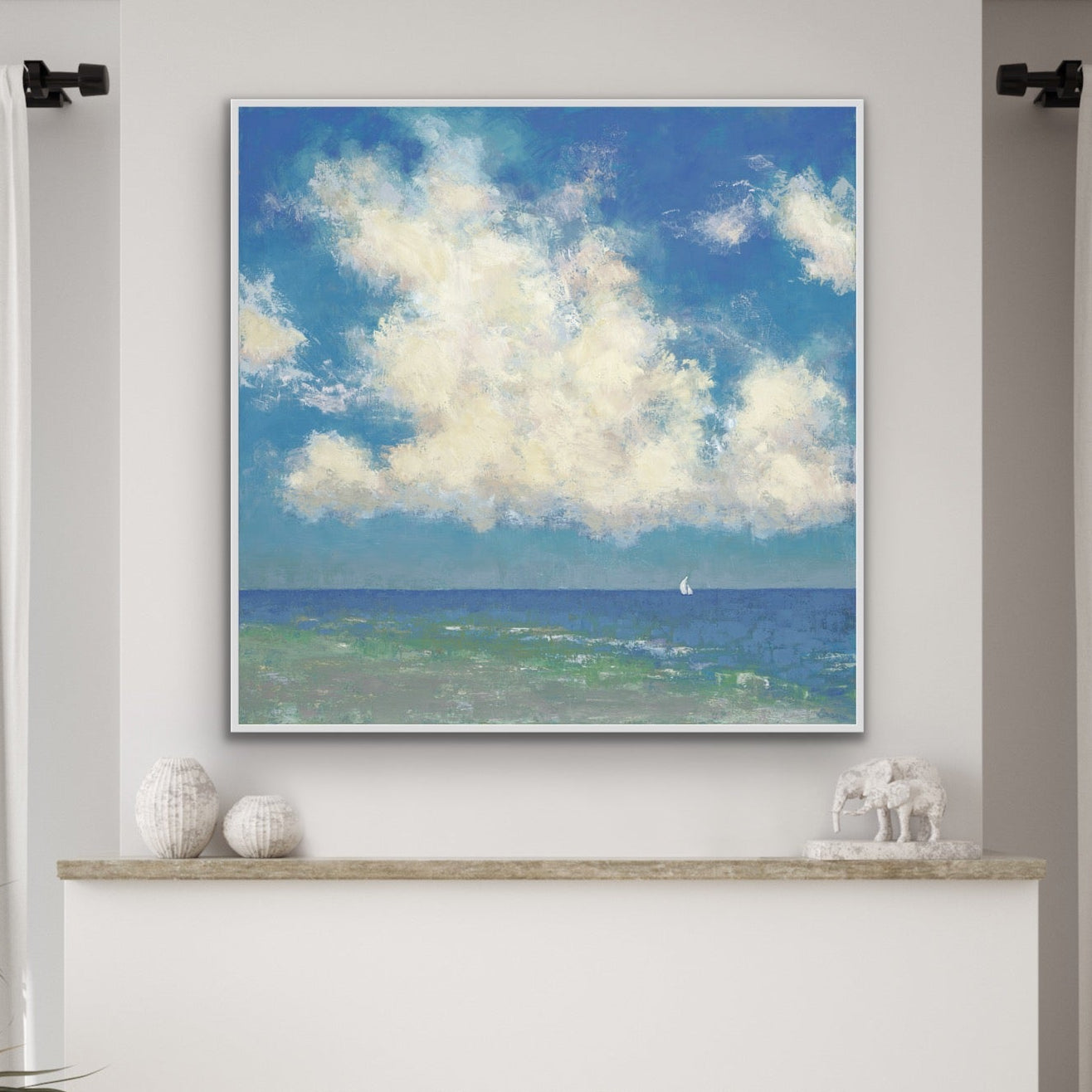 Over the fireplace a beautiful seascape on a sunny day with a sailboat