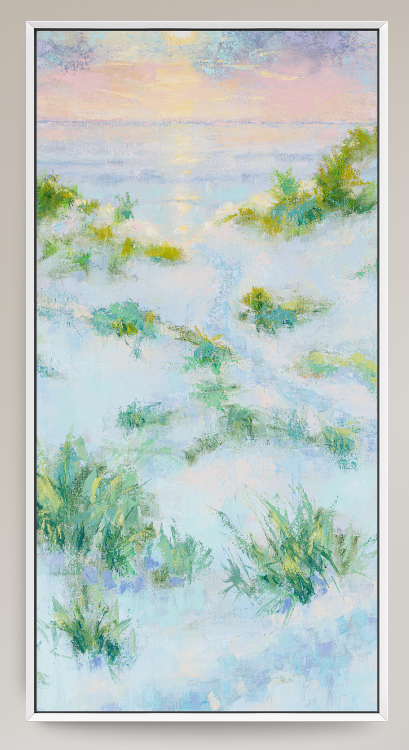 A framed vertical landscape painting depicting a soft, impressionistic coastal scene with pale blue and white water or mist, green grasses, and a pastel sky in pink, yellow, and blue tones.