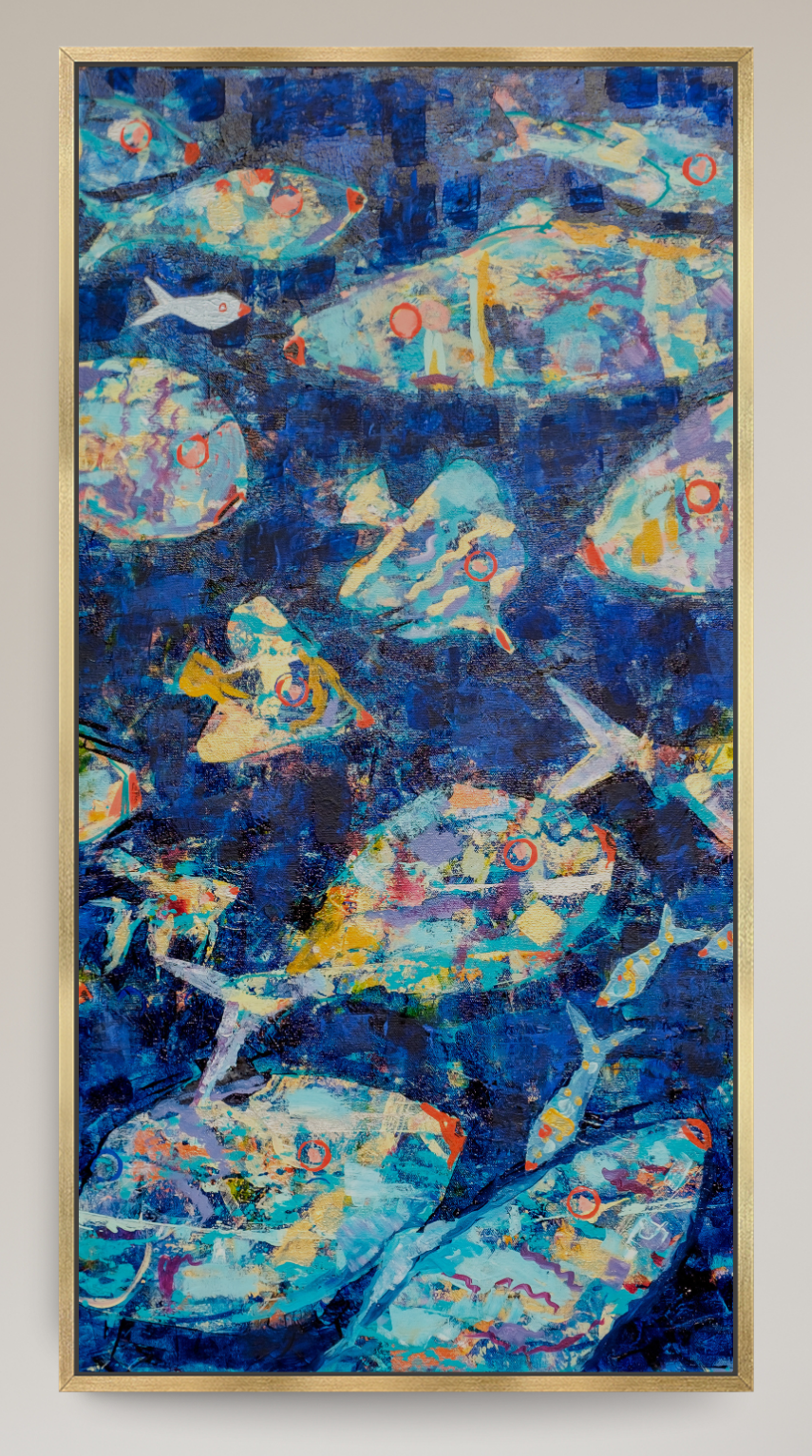 A framed abstract painting featuring blue, teal, and white fish-like forms, displayed on a light beige wall in a modern living room setting with a gray armchair and a console table.