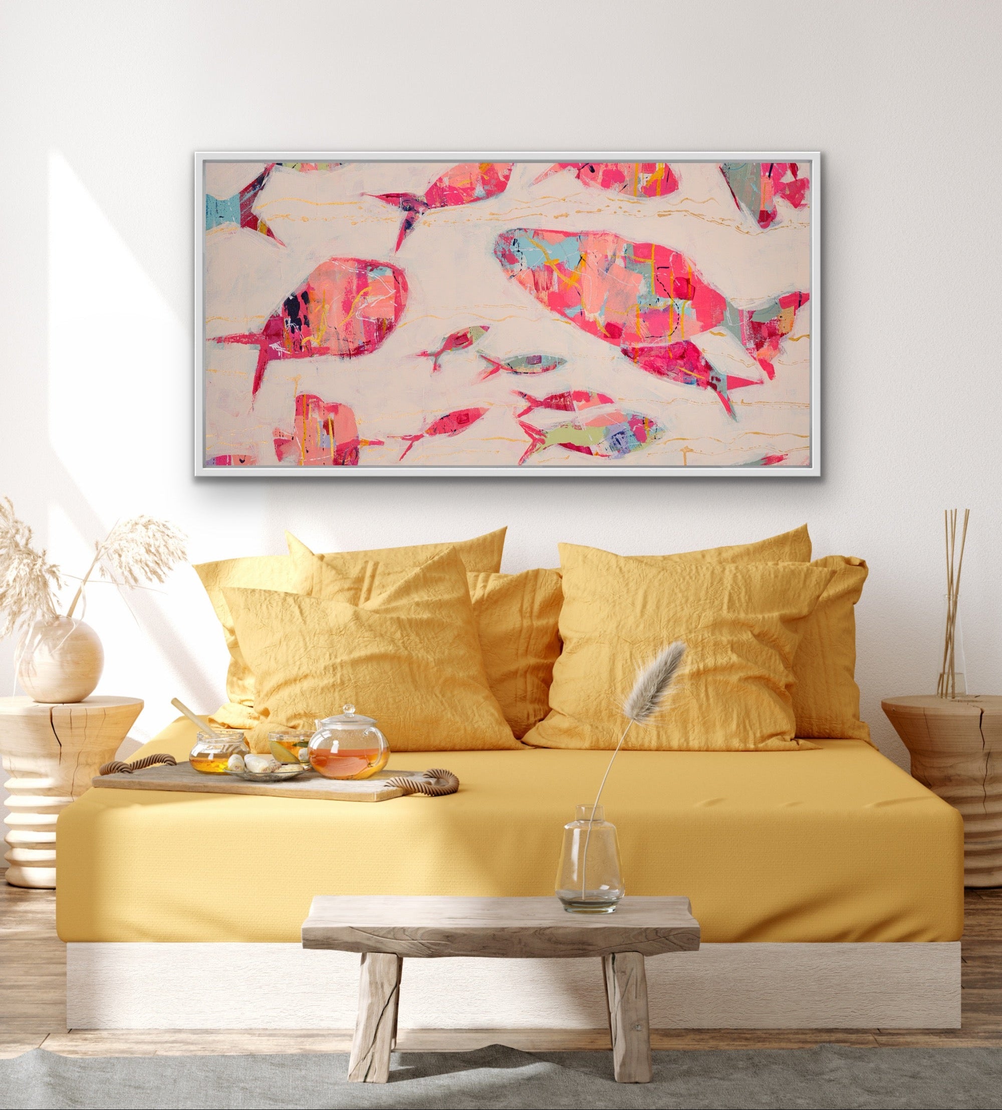 Yellow bed with a horizontal abstract fish painting with bright coastal colors on giclée canvas on the wall in a bedroom setting