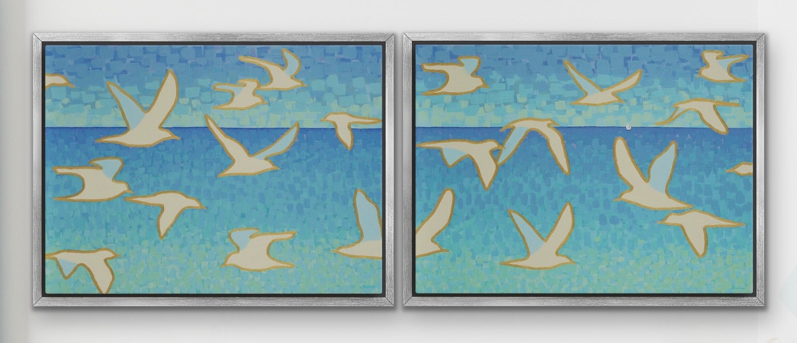 Golden outlined seagulls flying across two-panel coastal artwork