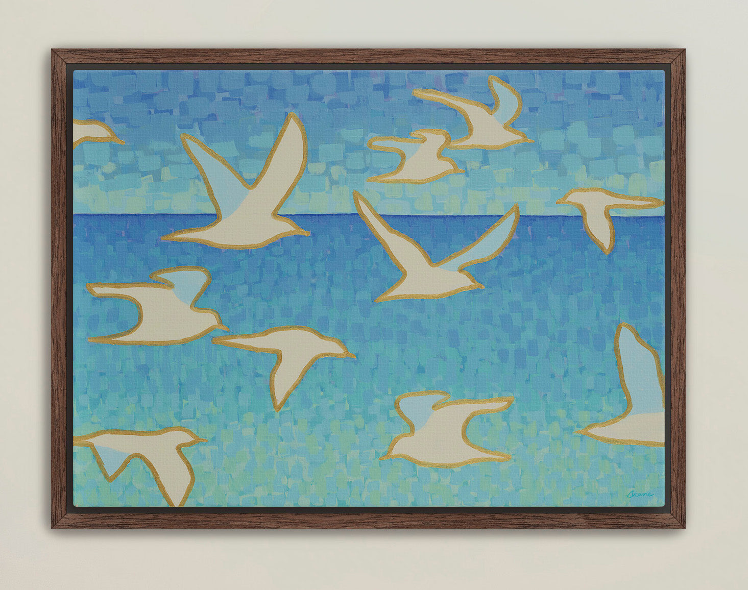 Framed coastal wall art featuring seagulls in flight over blue ocean tones